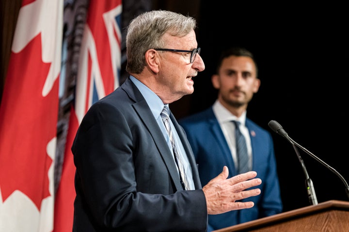 Dr. David Williams, Ontario's Chief Medical Officer of Health and Stephen Lecce, Minister of Education, at Queen's Park in Toronto on Aug. 13, 2020.