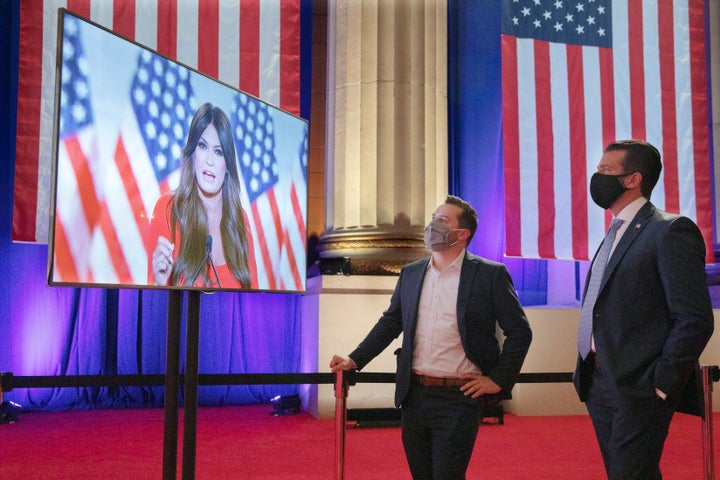 Donald Trump Jr. (right) watches his girlfriend, Kimberly Guilfoyle, a Trump campaign aide, as she records her address for Monday night's Republican National Convention program.