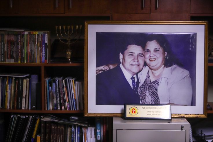 A portrait of Pastor Ovidio Valladares and his wife Aura Maria Valladares is displayed in his office at Bethel evangelical church in Managua, Nicaragua, Wednesday, Aug. 12, 2020. Valladares died from COVID-19 related complications on June 5th.