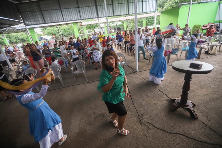 People attend a religious service at the Oasis of Peace evangelical church in Managua, Nicaragua, Sunday, Aug. 16, 2020. 