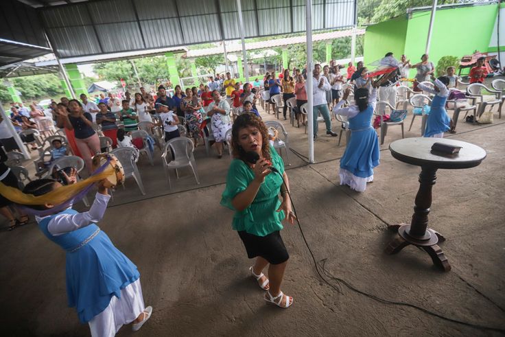 People attend a religious service at the Oasis of Peace evangelical church in Managua, Nicaragua, Sunday, Aug. 16, 2020. 