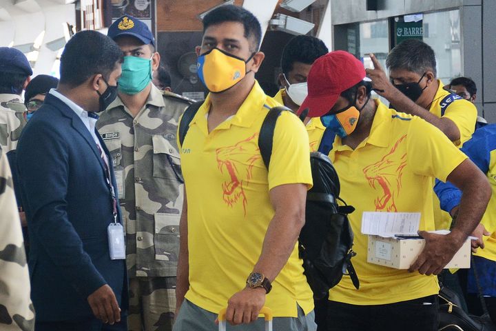 Chennai Super Kings captain Mahendra Singh Dhoni (C) arrives along with his teammates at the airport to take a flight to Dubai for the upcoming Indian Premier League (IPL) cricket tournament, in Chennai on August 21, 2020.
