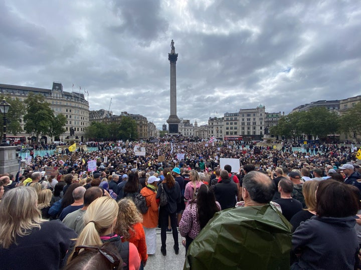 Anti-mask protesters are seen at the Unite for Freedom protest in Trafalgar Square. 