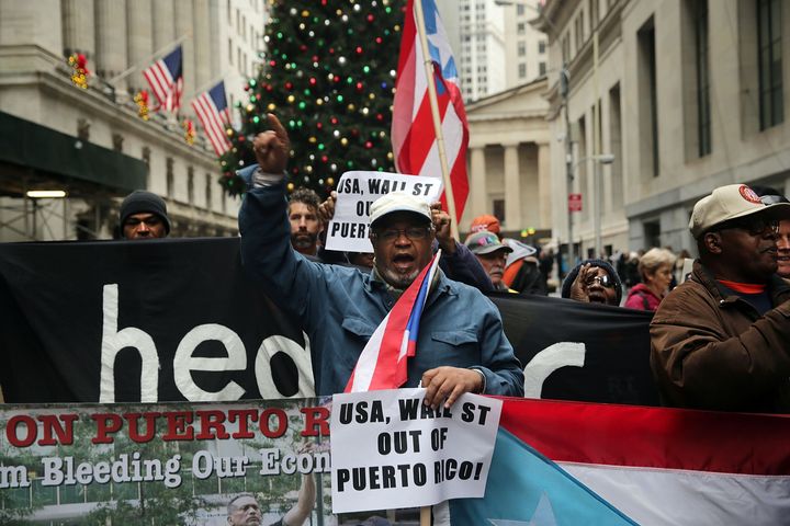 Puerto Rican protesters march on Wall Street in New York City in 2015, which activists blame for worsening the island's debt crisis.