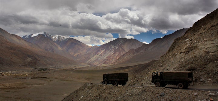 Indian army trucks drive near Pangong Tso lake in Ladakh on September 14, 2017.