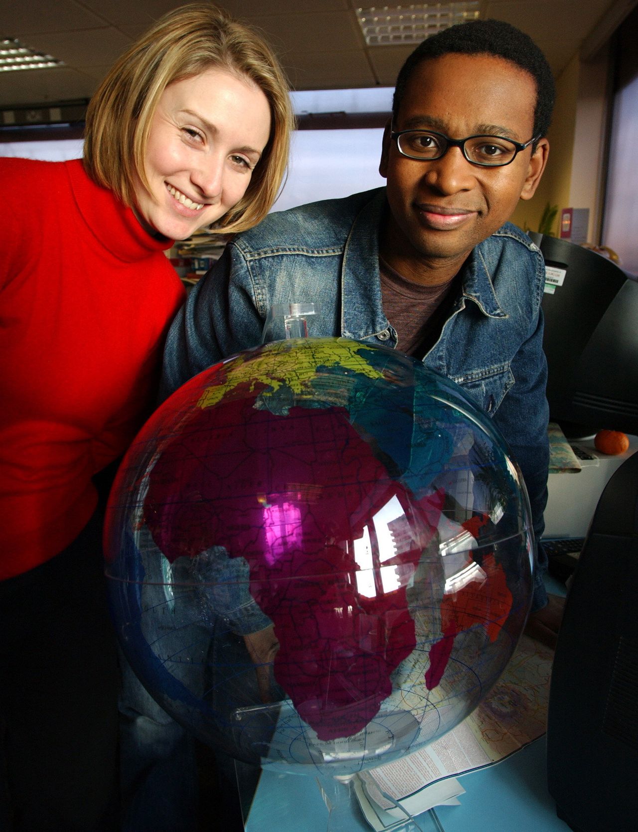 Newsround presenters Laura Jones and Lizo Mzimba pictured in 2003: teachers now using the show in their classrooms may have grown up watching the likes of these two on TV.