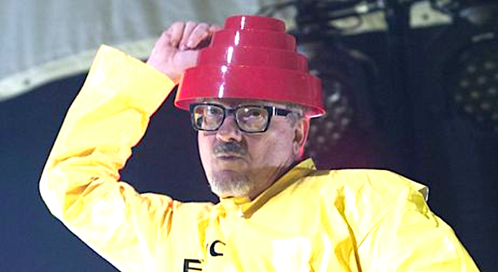 Devo's Mark Mothersbaugh, pictured performing in 2014, recalled "very dark delusions" during his ICU isolation.