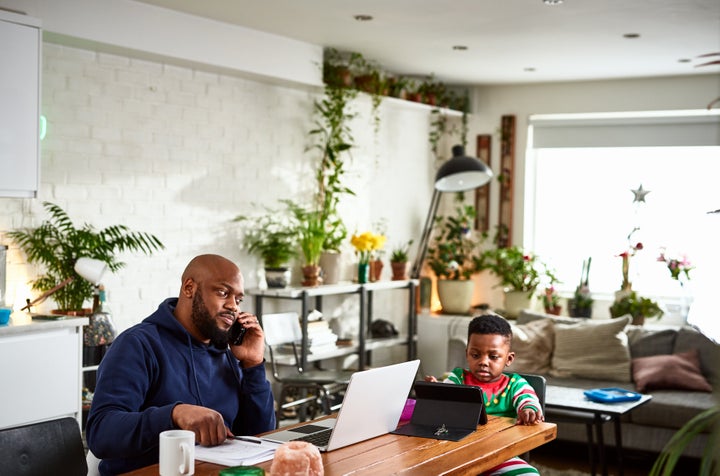 Man working from home, childcare issues, multi tasking