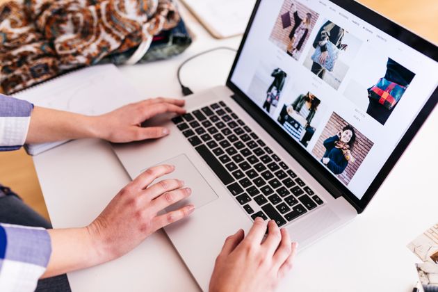 Close-up of two women working on photos on laptop