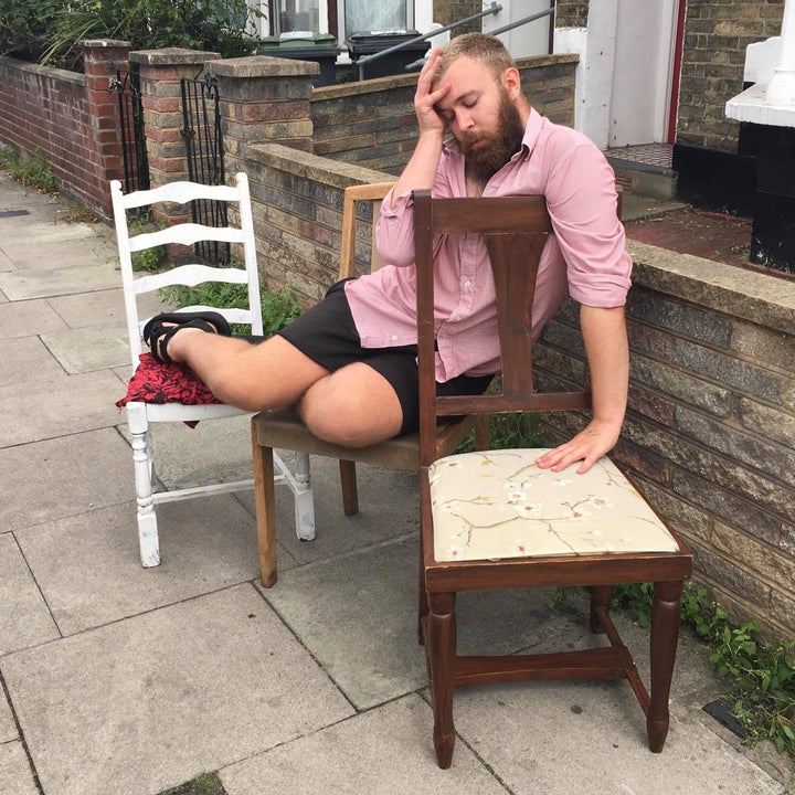 Sam models some mismatched dining chairs. 