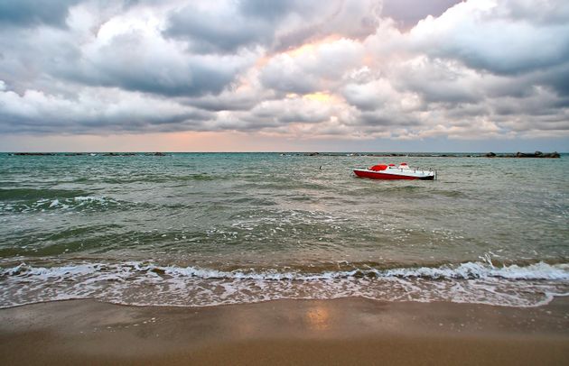 Sea with boat and cloudy