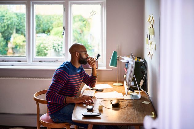 Man using computer in home office