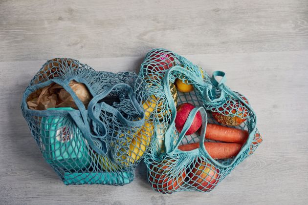 Vegetables in a material string shopping bag