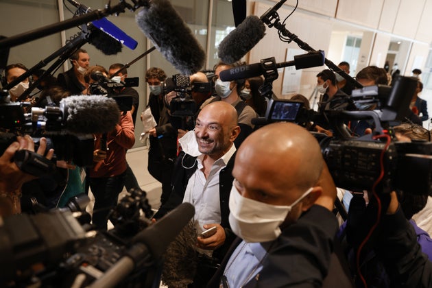 Charlie Hebdo's lawyer Richard Malka answers questions from reporters as he arrives at the Paris