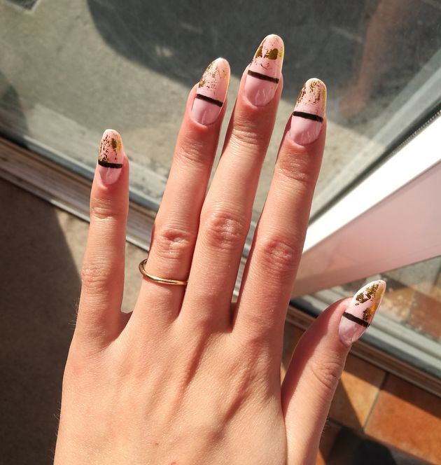 Gel nails on a woman's hand in neon colours