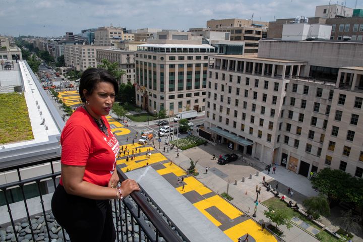 Mayor Muriel Bowser looks out over a Black Lives Matter sign that was painted during anti-racism protests in Washington, D.C., on June 5, 2020.