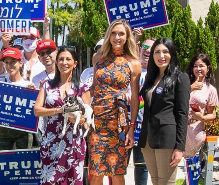 Lara Trump, center, an adviser to her father-in-law's presidential campaign, poses for a photo with Laura Loomer, right, one