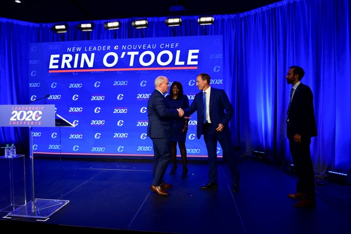 Erin O’Toole greets fellow candidates Peter MacKay and Leslyn Lewis after being elected leader of the federal Conservative party.