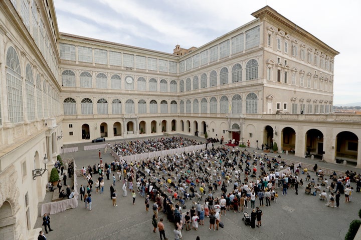 Catholics listen to Pope Francis during his general audience at the San Damaso courtyard, at the Vatican, Wednesday, Sept. 2, 2020.