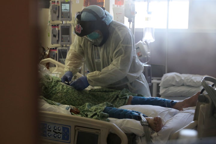 A patient suffering from COVID-19 is treated in the Intensive Care Unit at Scripps Mercy Hospital in Chula Vista, California, back in May.