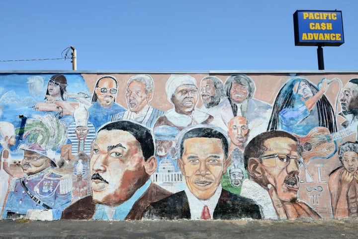 You're far more likely to read "African American" in history books, but many feel that Black is more inclusive to Caribbean and Central and South American people of color. Here, a mural in South Central Los Angeles highlights Black historical figures of the past and present.