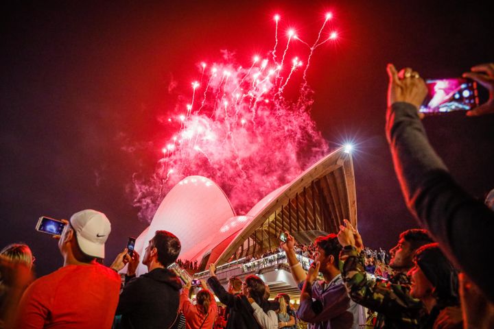 Fireworks explode over the Sydney Harbour Bridge and Sydney Opera House during the midnight display during New Year's Eve celebrations on January 01, 2020 in Sydney, Australia.