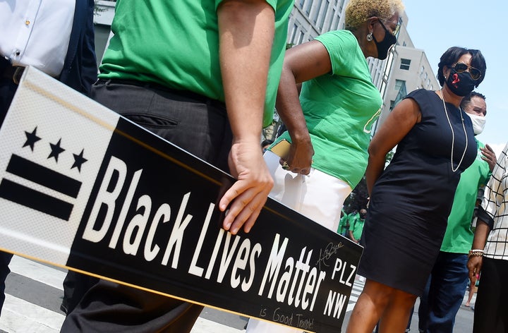 Mayor Muriel Bowser waits at Black Lives Matter Plaza to watch the funeral procession for Congressman and civil rights leader John Lewis (D-Ga.) in Washington, D.C., on July 27, 2020. 