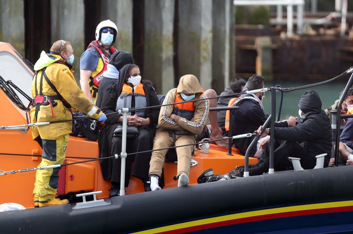 A group of people thought to be migrants are brought into Dover, Kent, by the RNLI following a small boat incident in the Channel. (Photo by Andrew Matthews/PA Images via Getty Images)