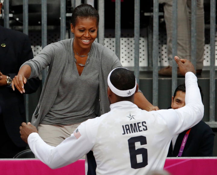 Michelle Obama and LeBron James greet each other during the 2012 Olympics.