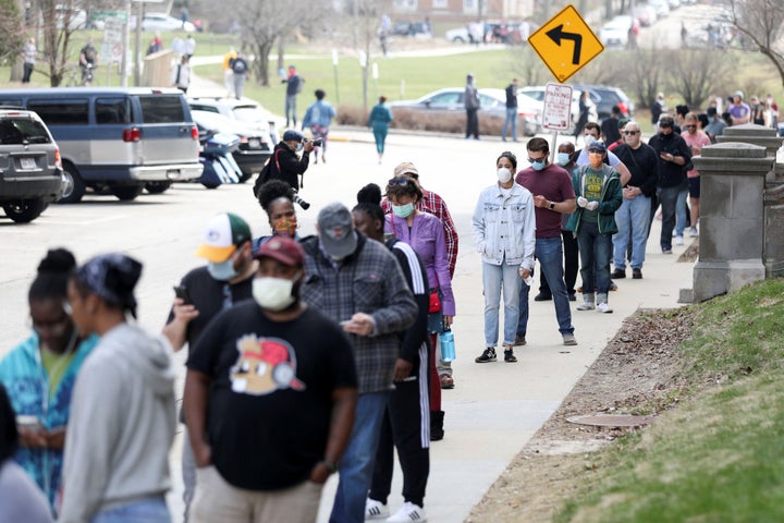 Voters waiting in line in Milwaukee for the primary on April 7. The state had trouble finding poll workers so had to consolidate precincts.