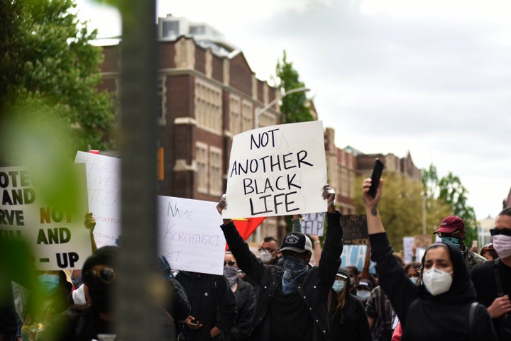 Protesters chanting during a Toronto rally to protest police-involved deaths in North America on May 30, 2020.