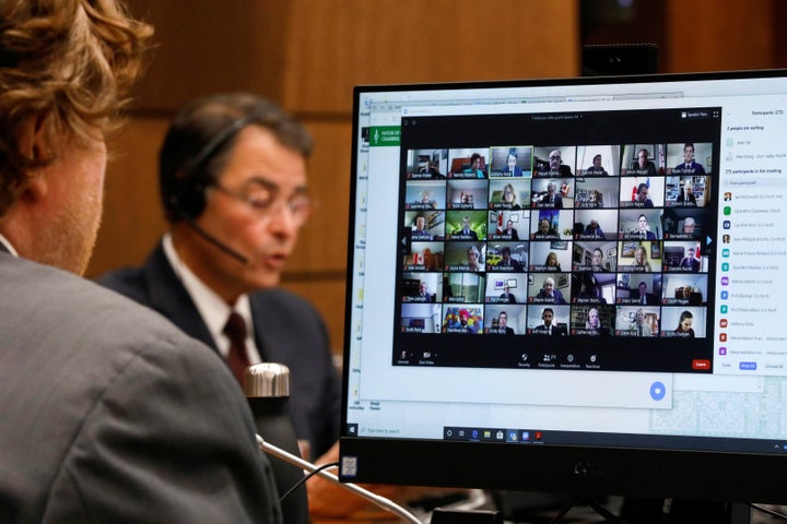 Canadian Members of Parliament, displayed on a computer monitor, attend the first virtual meeting of the special committee on the COVID-19 pandemic, as efforts continue to slow the spread of the coronavirus disease (COVID-19), on Parliament Hill in Ottawa, Ontario, Canada April 28, 2020. REUTERS/Blair Gable