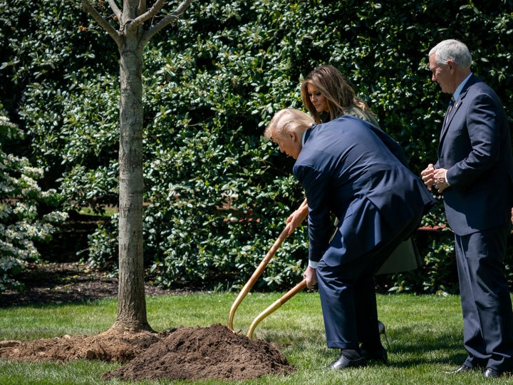 President Donald Trump and first lady Melania Trump participate in a tree-planting ceremony in recognition of Earth Day and A