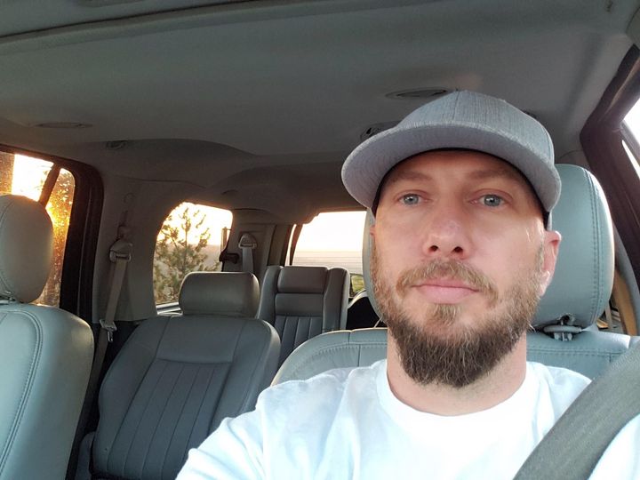 Activist Jeremy Logan, pictured here in his car, says unidentified officers in Spokane, Washington, abducted him as he walked to a protest and put him in an unmarked van.