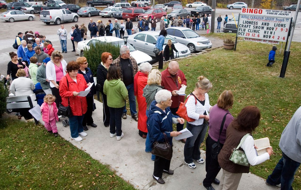 Residents line up for H1N1 vaccinations, administered by Peterborough Health Unit, at a branch of Royal Canadian Legion in rural Lakefield, Ont. on Oct. 29, 2009.