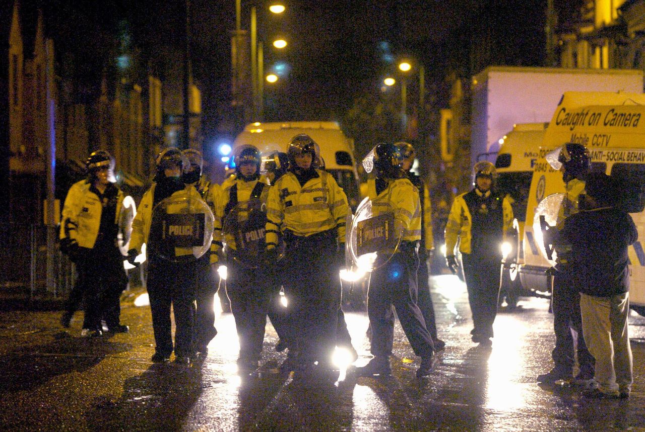 Police take to the streets during a second night of violence in Lozells, Birmingham, in October 2005