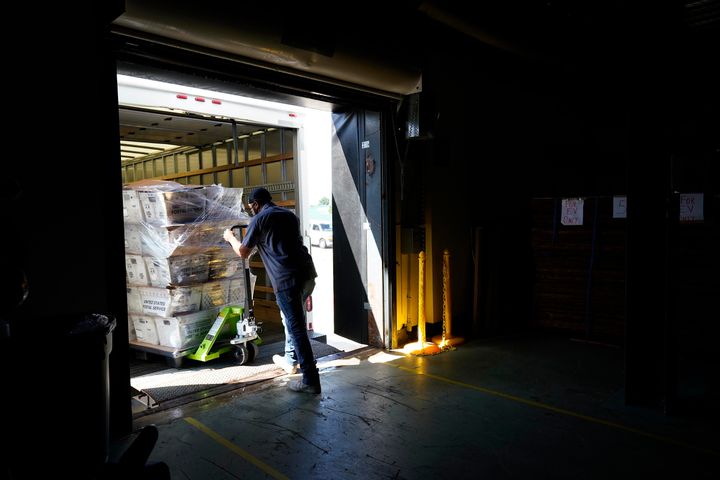 A load of absentee ballots is loaded onto a truck for mailing at the Wake County Board of Elections in North Carolina Thursday.
