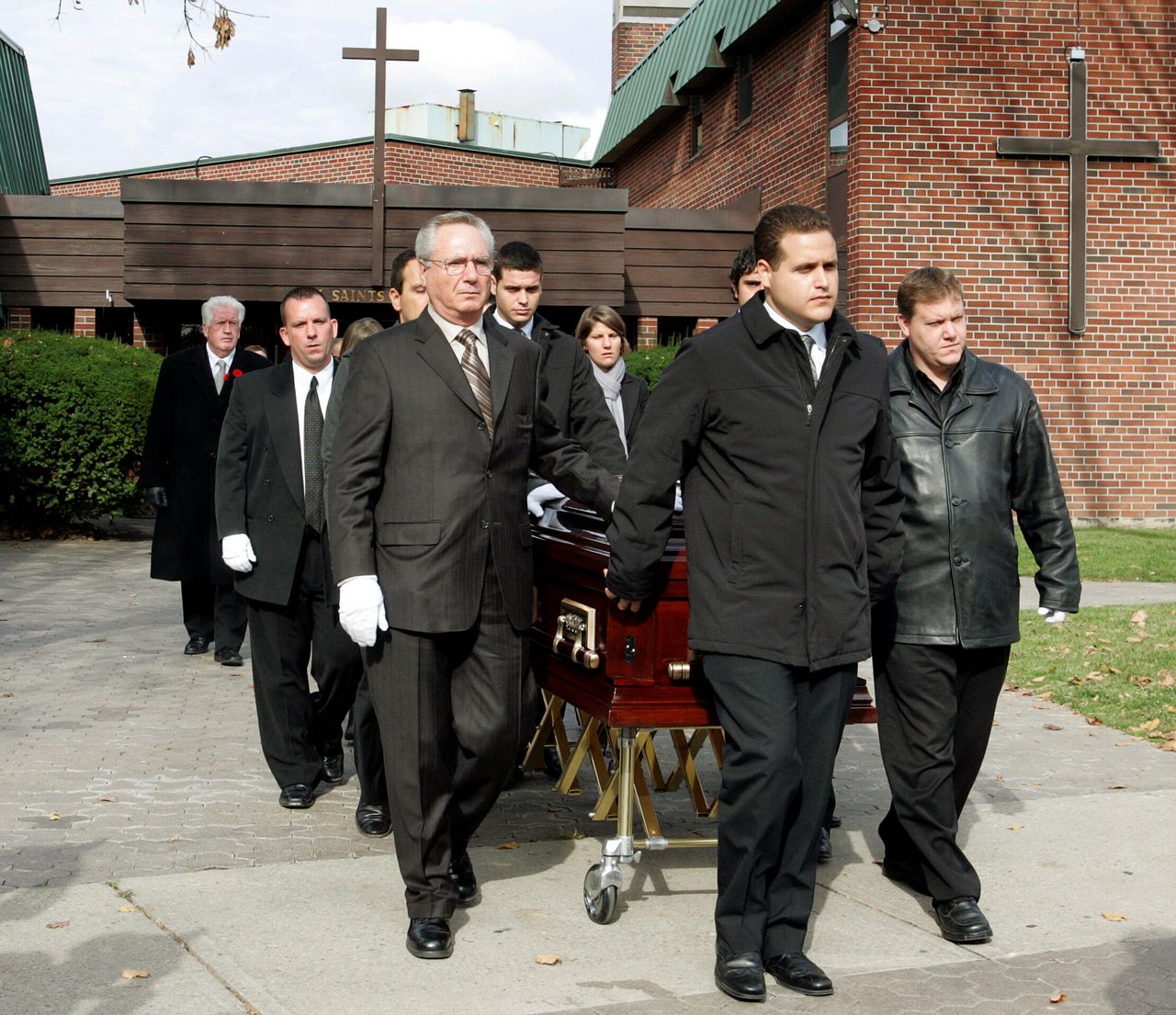 Pallbearers walk with the casket after funeral services for 13-year-old Evan Frustaglio in Toronto on Nov. 2, 2009. Frustaglio passed away after contracting the H1N1 virus. The boy's sudden death triggered widespread public concern, and families flocked to hospitals and health clinics to be vaccinated against the H1N1 virus.