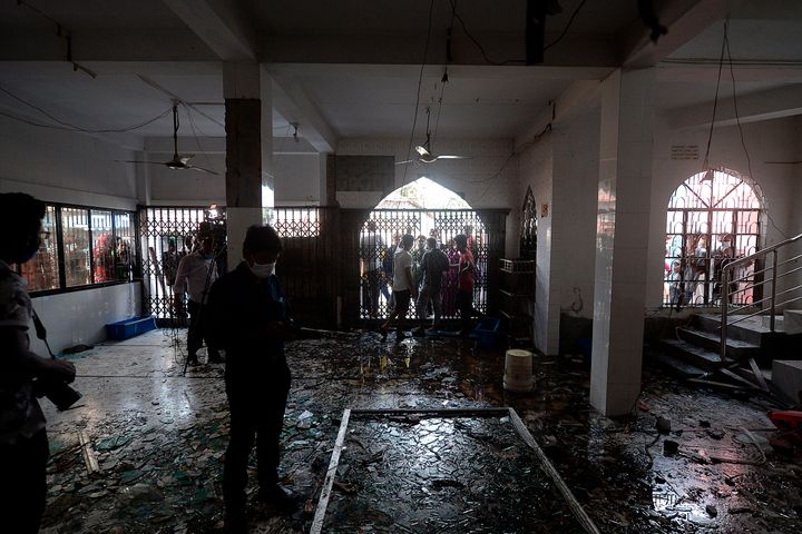 Shattered glasses are seen inside a mosque following a fire in the central district of Narayanganj, on September 5, 2020
