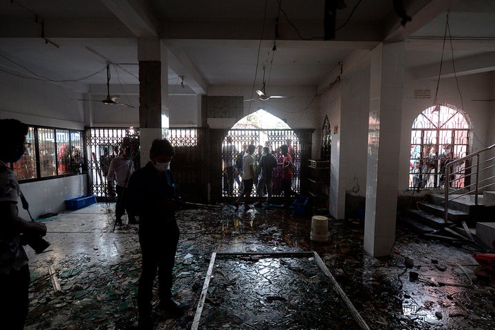 Shattered glasses are seen inside a mosque following a fire in the central district of Narayanganj, on September 5, 2020