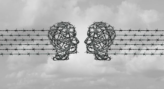 Hate speech communication concept,and online hate chat as two heads made of barbed wire communicating...