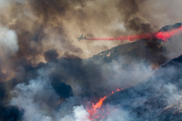 A fire burns at a hillside in Yucaipa, Calif., Saturday, Sept. 5, 2020. A brutal heat wave pushed temperatures above 100 degrees in many parts of California over the weekend.