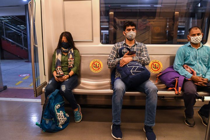 Commuters in a carriage of a Yellow Line train in New Delhi on September 7, 2020. 