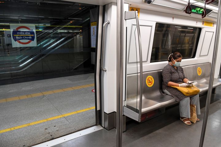 A commuter sits in a carriage of a Yellow Line train in New Delhi on September 7, 2020. 