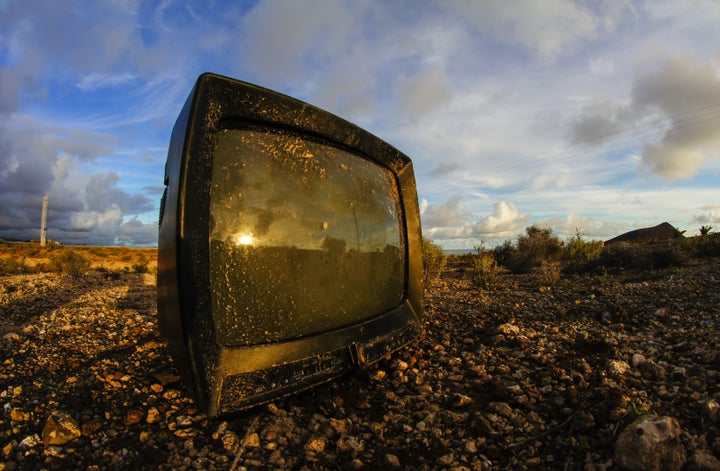 Abandoned Broken Television in the Desert on a Cloudy Day