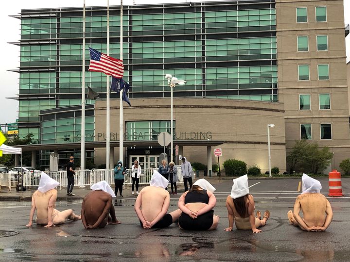 Naked protesters stage a demonstration to protest the death of Daniel Prude at Rochester's Public Safety Building in Rochester, New York, U.S. September 7, 2020. (Tracy Schuhmacher/Democrat and Chronicle via USA TODAY)