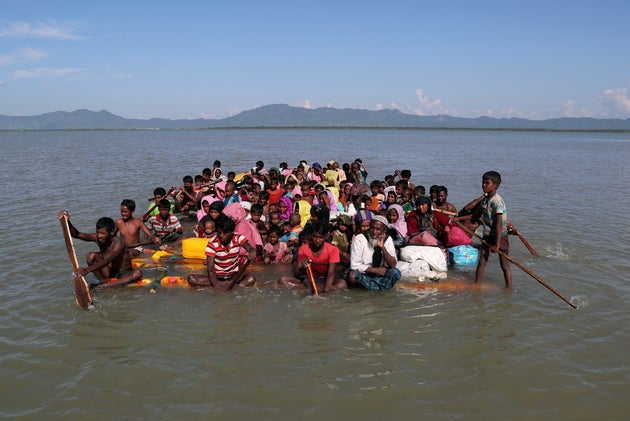Rohingya refugees cross the Naf River to reach Bangladesh on November 10,