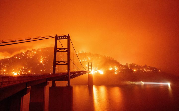 The Bidwell Bar Bridge is surrounded by fire in Lake Oroville during the Bear fire in Oroville, California.