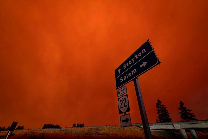 Red sky and thick smoke are seen in Salem City, Oregon, U.S., September 8, 2020, in this picture obtained from social media. Picture taken September 8, 2020. ZAK STONE/via REUTERS