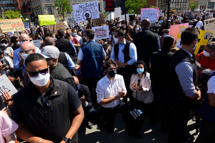 Prime Minister Justin Trudeau kneels as he takes part in an anti-racism protest on Parliament Hill in Ottawa on June 5, 2020.
